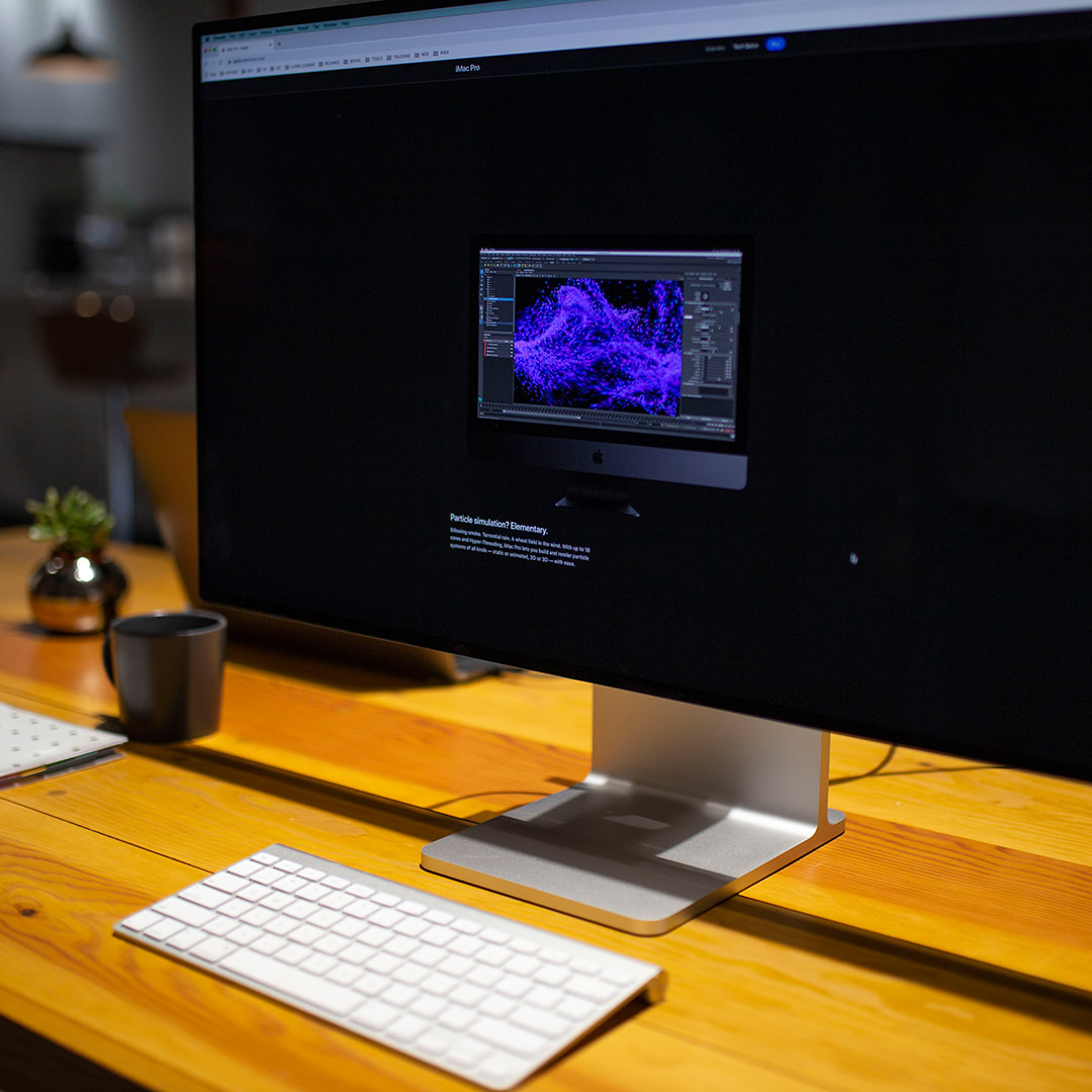 iMac Pro display sitting on a wooden desk
